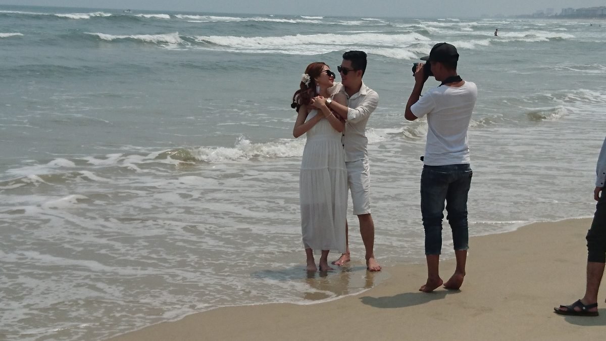 The only thing that litters My Khe beach is newlyweds – every ten metres there's another young couple shooting their wedding photos