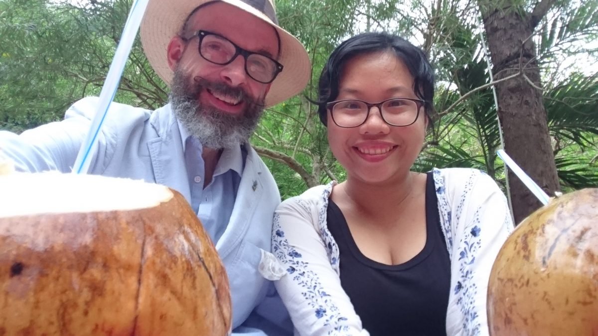 Drinking fresh coconut milk on the climb back down the Marble Mountains