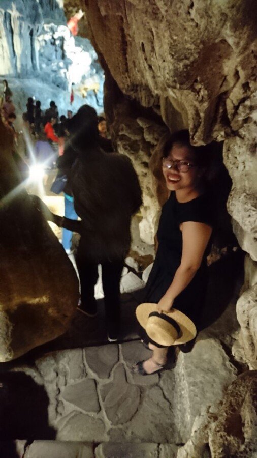 Climbing down in to the 'Surprise Cave' inside Bo Hon island, one of the visits on any Halong Bay cruise